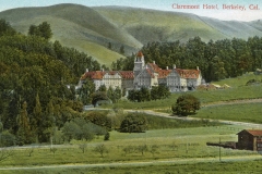 A vintage postcard depicting Claremont Hotel in Berkeley, California. The hotel is surrounded by lush greenery and rolling hills on a clear day. A winding road and a small building are visible in the foreground.