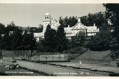 Vintage photograph of the Claremont Hotel in Berkeley, California, featuring a tennis court in the foreground with players and an umbrella-shaded seating area. The grand hotel building is surrounded by trees and hills.