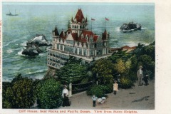Vintage postcard illustration of Cliff House perched on a cliff above the Pacific Ocean in San Francisco, with Seal Rocks in the water, lush greenery in the foreground, and people strolling on a path. Text reads: Cliff House, Seal Rocks and Pacific Ocean.
