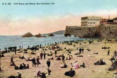Vintage postcard showing many people relaxing and walking on a beach near rocky cliffs, with the historic Cliff House overlooking the ocean in San Francisco.