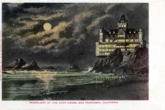 A large, illuminated Victorian-style building sits on a cliff above the ocean under a full moon, with waves crashing on rocks below. Text reads: Moonlight at the Cliff House, San Francisco.