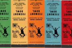 A series of colorful vintage matchbooks, advertising Fremont Bowl, featuring a joyful person jumping with a bowling ball. The text includes details about cocktails, cuisine, and location in Fremont, California. Posters are flipped upside down.
