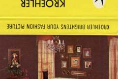 A vintage advertisement matchbook, featuring a living room with a white couch, chairs, and a wooden coffee table. Elegant drapes and paintings decorate the room. Text above reads KROEHLER MFG. CO. along with contact information.