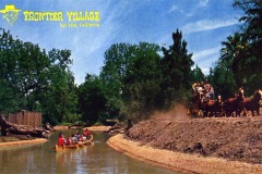 A canoe with people paddling on a river passes through a wooded area, while a horse-drawn stagecoach carries passengers on a dirt path. The image is labeled Frontier Village, San Jose, California in the top left corner.