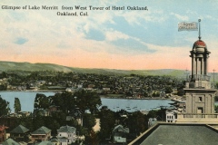A vintage postcard view from the West Tower of Hotel Oakland, showing Lake Merritt and surrounding houses. The tower has a flag labeled Hotel Oakland, with hills in the distance under a blue sky.