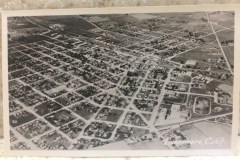 Aerial black-and-white photograph of a grid-patterned urban area with homes, streets, and some greenery. The word Livermore, Calif. is written in the lower right corner.