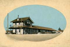 A vintage illustration of the S.P. Depot in Livermore, California. The image shows a two-story train station with a sign reading Livermore and several horse-drawn wagons nearby, set against a blue sky.