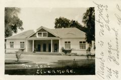 A vintage photograph of a large, single-story house with a gabled roof and covered porch. The caption The Rest is written below, and LIVERMORE is handwritten. Text on the right side reads Maude is not with me now. She is in Berk. not L.C.