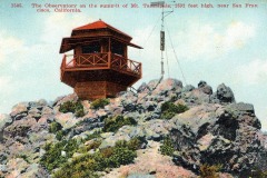 A vintage postcard of a wooden observatory perched atop rocky terrain on Mt. Tamalpais, California. The structure has a red roof and a wraparound balcony. An antenna stands nearby. Text indicates the altitude is 2,592 feet, near San Francisco.