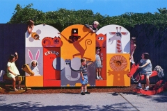 Children are playing in a colorful playground with animal-themed panels and spring riders shaped like a horse and a rooster. The backdrop features illustrations of a monkey, giraffe, elephant, and lion. Trees are visible in the background.