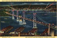 A vintage postcard of the San Francisco-Oakland Bay Bridge at night, illuminated by lights, with the cityscape of San Francisco in the background. Red searchlights beam into the sky, and boats are visible below the bridge.