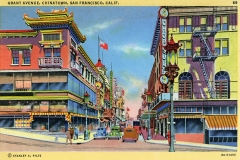 A vintage postcard of Grant Avenue in Chinatown, San Francisco. The scene features colorful buildings with traditional Chinese architecture, street lamps, cars, and people walking. A clear blue sky is in the background.