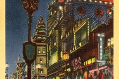 Vintage postcard illustration of a nighttime street scene in San Franciscos Chinatown. The street is lined with ornate lanterns and colorful, pagoda-style buildings. Several parked cars and people walking add to the bustling atmosphere.