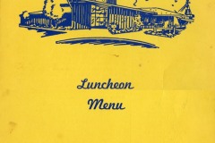 Yellow menu cover featuring a blue illustration of an angular building with Sea Wolf Restaurant written above. Text below reads Luncheon Menu and In Jack London Square • Oakland.