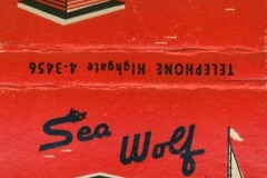 Red matchbook cover for Sea Wolf Restaurant, showcasing a drawing of the venue by the water with boats. It reads Over the Bay in the Heart of Jack London Square and includes a phone number.