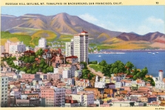 Vintage postcard depicting the Russian Hill skyline with buildings in the foreground and Mt. Tamalpais in the background, overlooking San Francisco Bay. The scene includes a mix of residential and taller buildings under a clear sky.