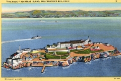 Illustrated postcard of Alcatraz Island in San Francisco Bay. The image shows the island with prison buildings, surrounded by water. A boat is visible near the island, and the mainland is in the background.