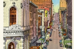 A vintage postcard of San Franciscos Powell Street shows historic buildings, a busy street with cars and a cable car climbing the hill. The foreground features the Bank of America building.