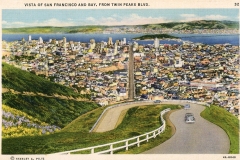 A vintage postcard illustration of San Francisco viewed from Twin Peaks Boulevard. The cityscape includes buildings, roads, and distant hills under a blue sky. A winding road with cars leads to the city, surrounded by greenery and white fences.